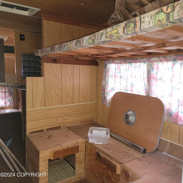 interior space featuring wood walls