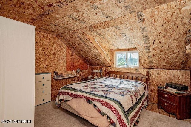 bedroom featuring light carpet and lofted ceiling