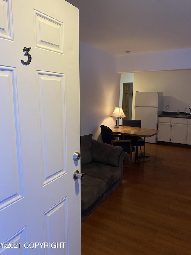 living area featuring dark wood-type flooring