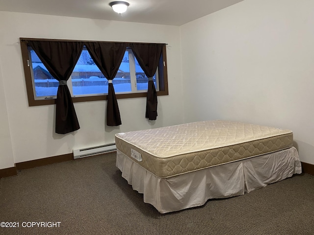 bedroom featuring baseboards, dark colored carpet, and a baseboard radiator