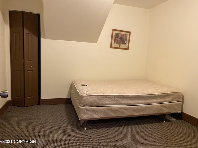 bedroom with carpet flooring and baseboards