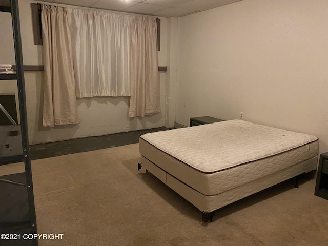 bedroom with a paneled ceiling