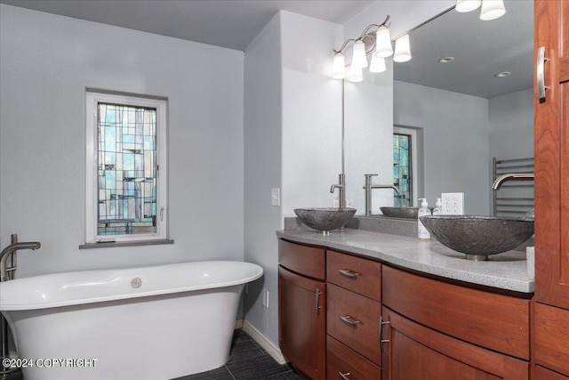 bathroom with vanity and a bathtub