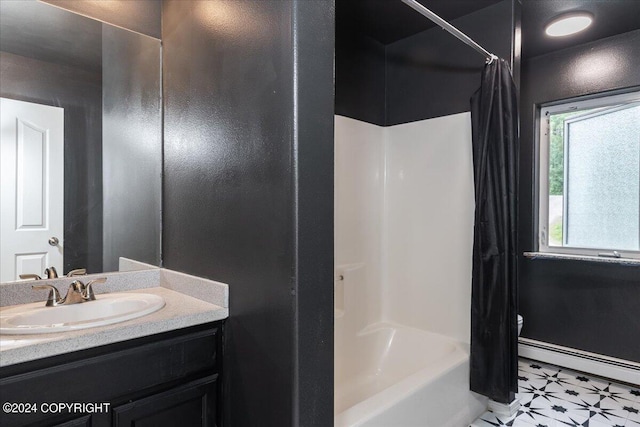 bathroom with vanity, shower / bath combo, and baseboard heating