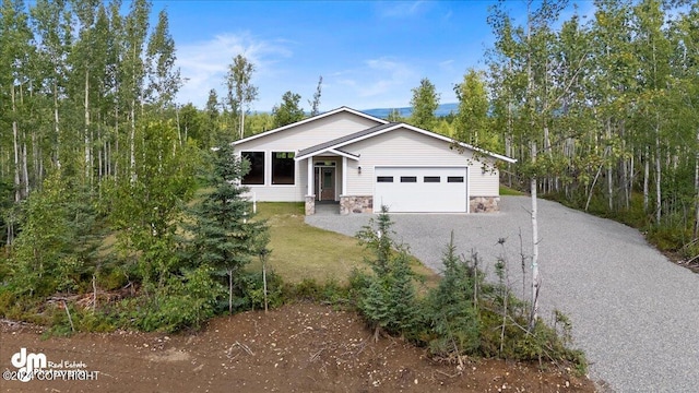 view of front of property featuring a front lawn and a garage