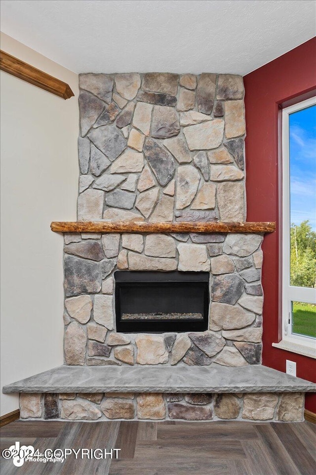 details featuring a fireplace and hardwood / wood-style floors