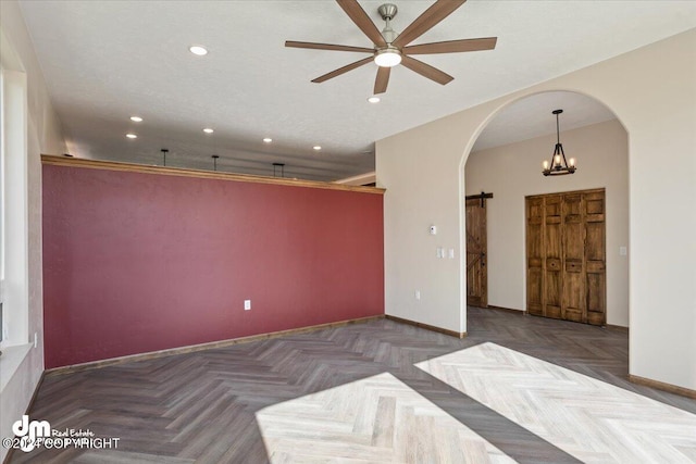 interior space featuring ceiling fan with notable chandelier and parquet floors