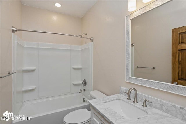 full bathroom with vanity, shower / bath combination, and toilet