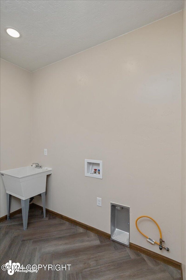 laundry room featuring hookup for a washing machine, parquet flooring, and gas dryer hookup