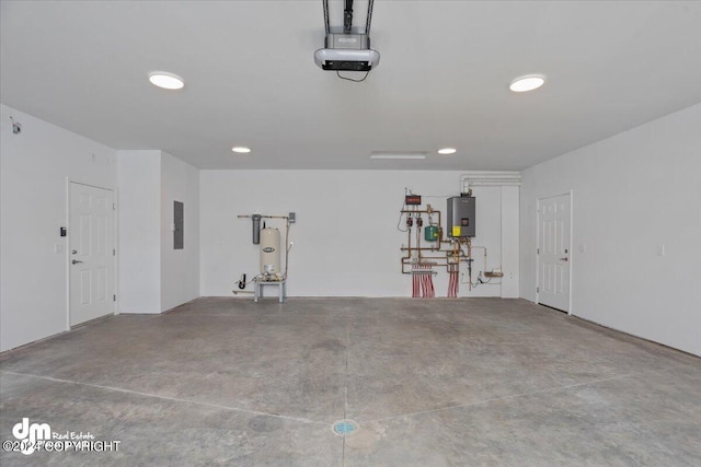 garage featuring water heater, electric panel, and a garage door opener