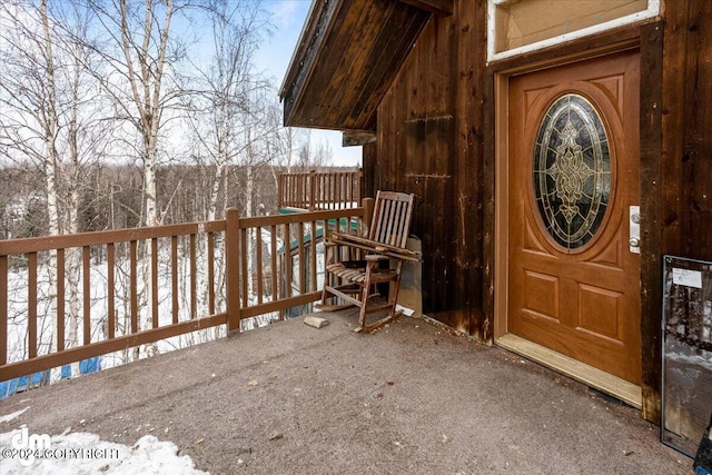 view of snow covered property entrance