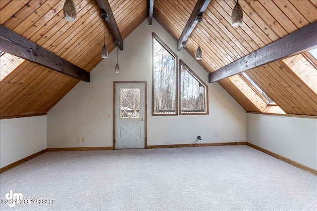 additional living space featuring lofted ceiling with skylight, carpet, and baseboards