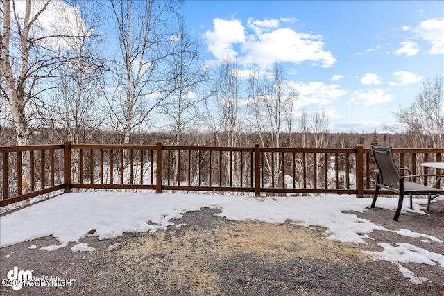 view of snow covered deck