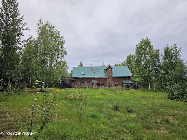 rear view of house with metal roof