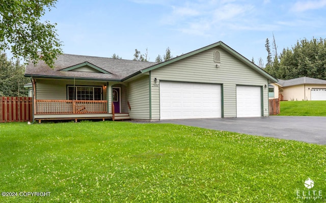 ranch-style home with a front lawn and a garage