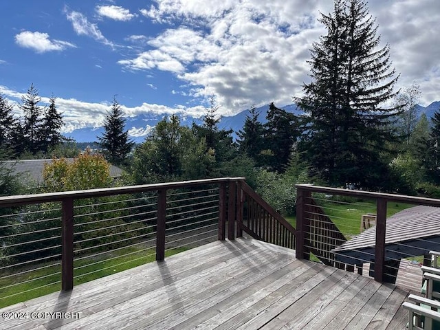 wooden terrace featuring a mountain view