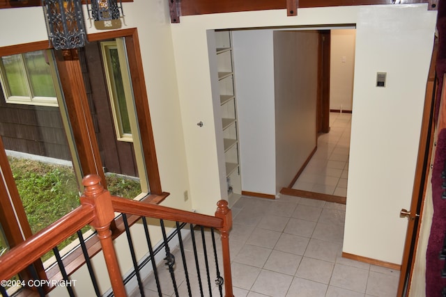 hallway with light tile patterned floors