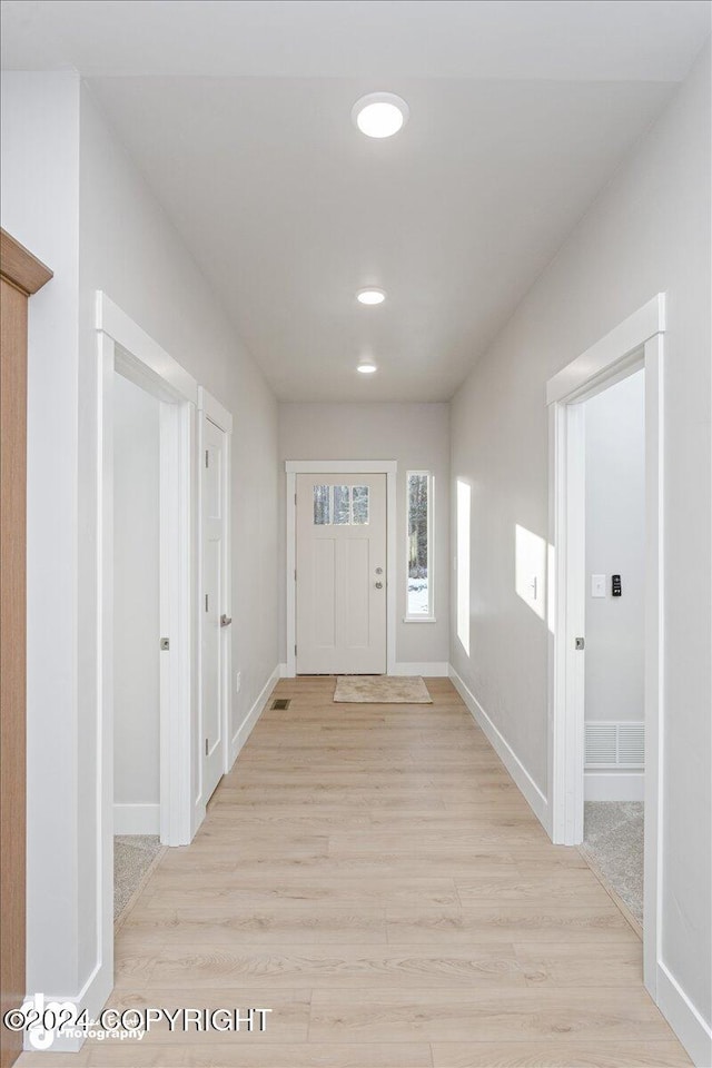 foyer entrance with light wood-type flooring