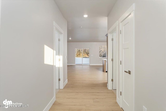 hall with light hardwood / wood-style flooring