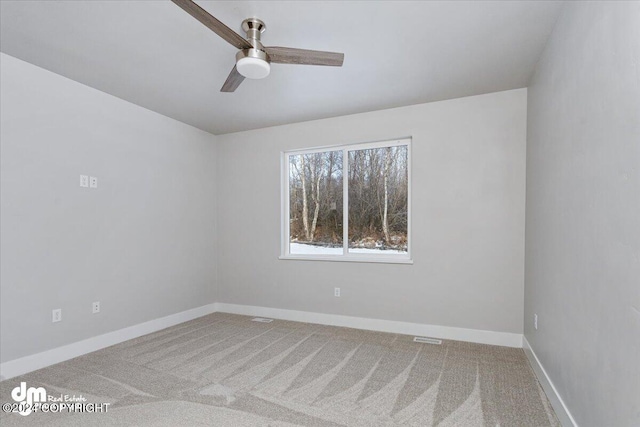 unfurnished room featuring carpet flooring and ceiling fan