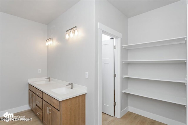 bathroom featuring vanity and hardwood / wood-style flooring