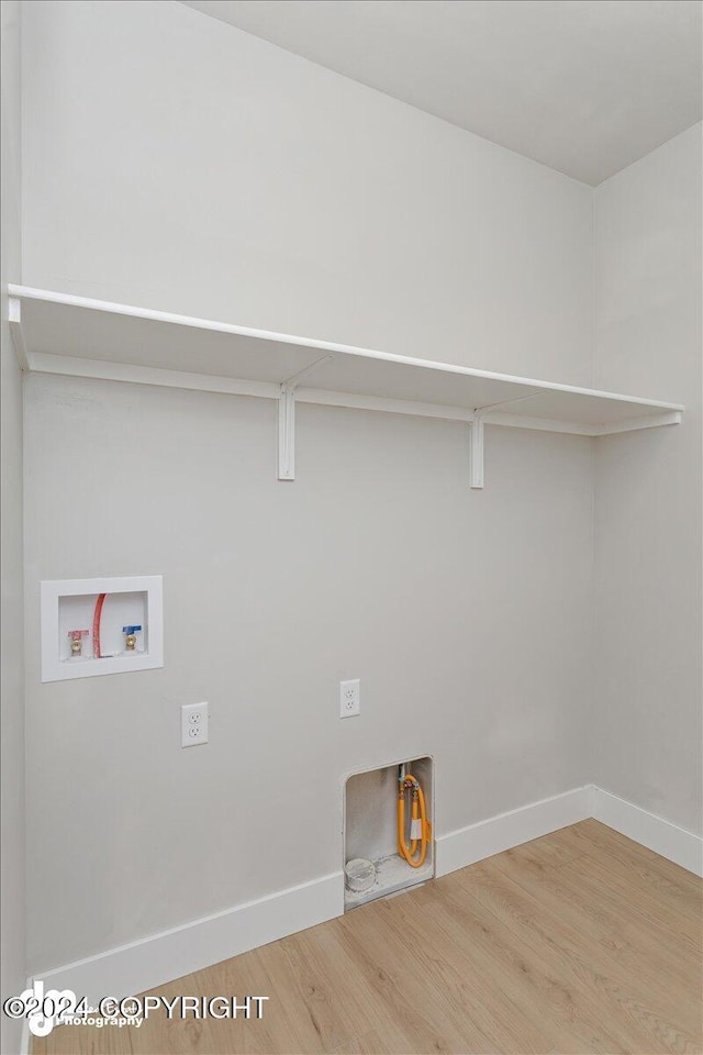 washroom featuring hardwood / wood-style floors and washer hookup