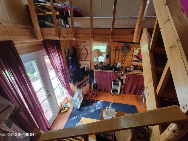 interior space with hardwood / wood-style flooring, a healthy amount of sunlight, and radiator heating unit