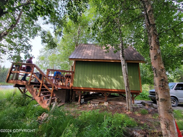 view of home's exterior with a wooden deck