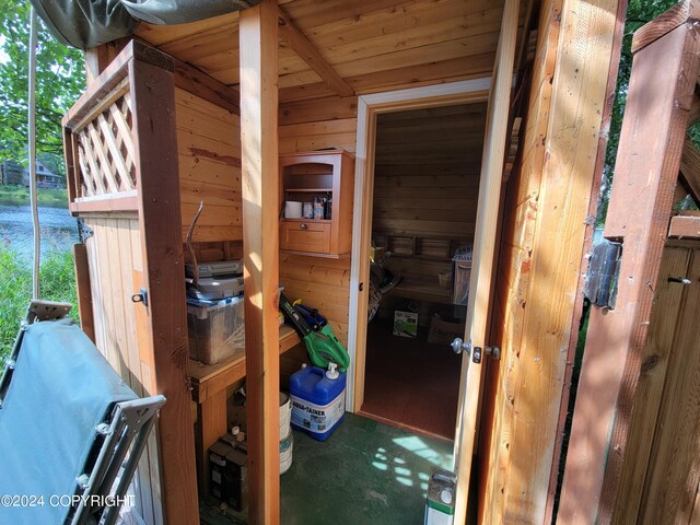 view of sauna / steam room featuring wooden walls