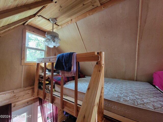 bedroom with lofted ceiling and wood ceiling