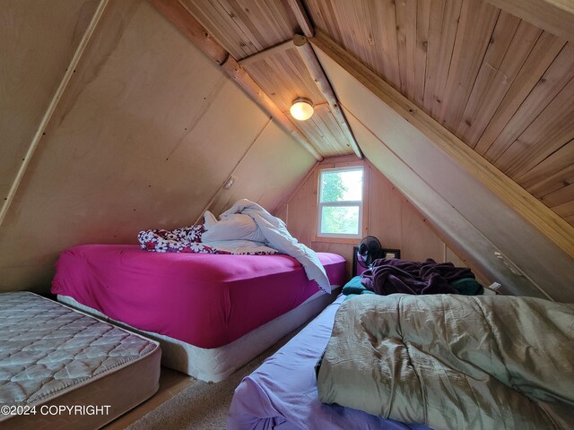 bedroom featuring wood ceiling and vaulted ceiling