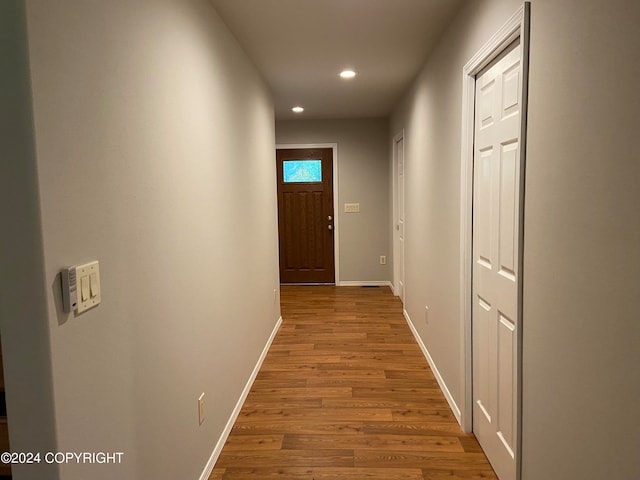 corridor featuring hardwood / wood-style flooring