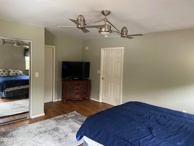 bedroom featuring ceiling fan and dark hardwood / wood-style floors