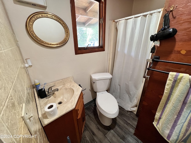 bathroom featuring hardwood / wood-style flooring, vanity, and toilet