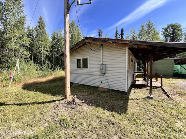 view of side of property with a yard