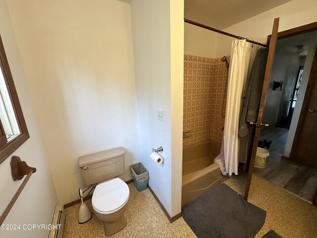 bathroom featuring a baseboard heating unit, toilet, and shower / bath combo