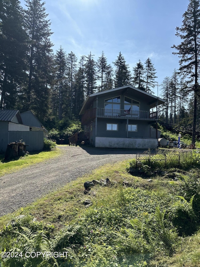 view of home's exterior with a balcony