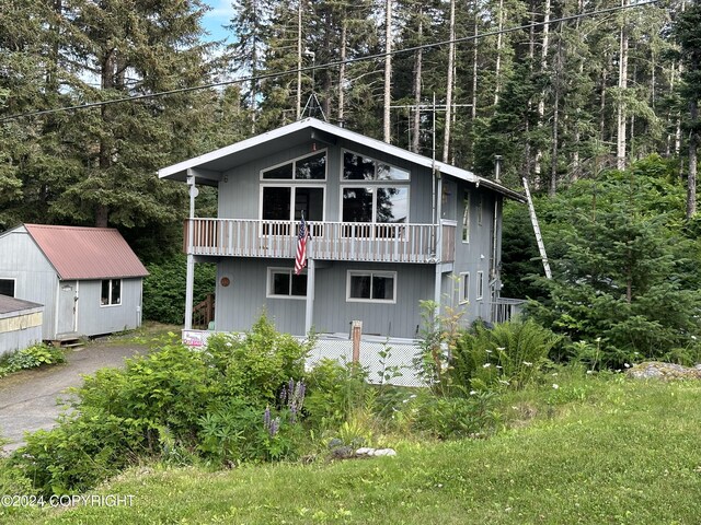 view of front of house with a storage unit