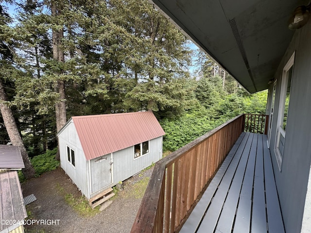 wooden deck featuring a shed