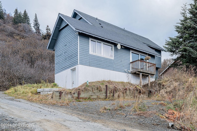 view of property exterior featuring a deck