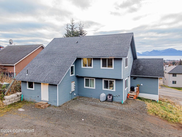 rear view of house with a mountain view