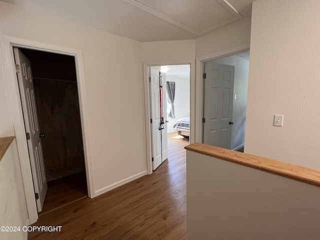 corridor with dark hardwood / wood-style floors