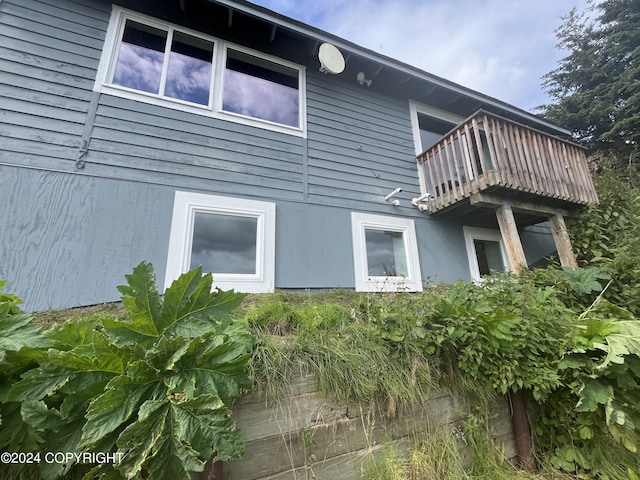 view of side of home with a balcony