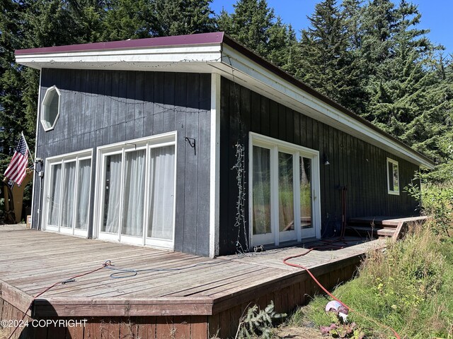 view of side of property with a deck