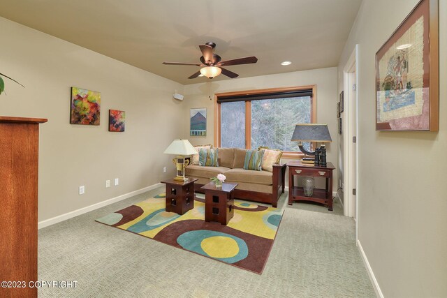 living room with light colored carpet and ceiling fan