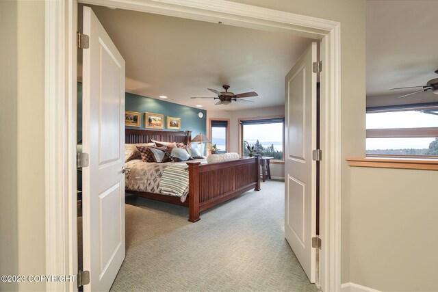 carpeted bedroom featuring ceiling fan