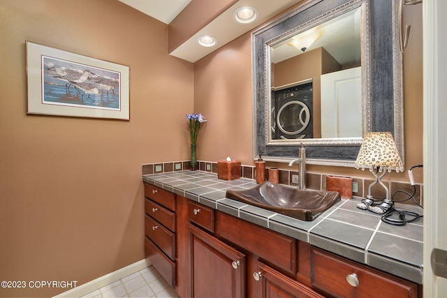 bathroom with vanity and tile patterned floors