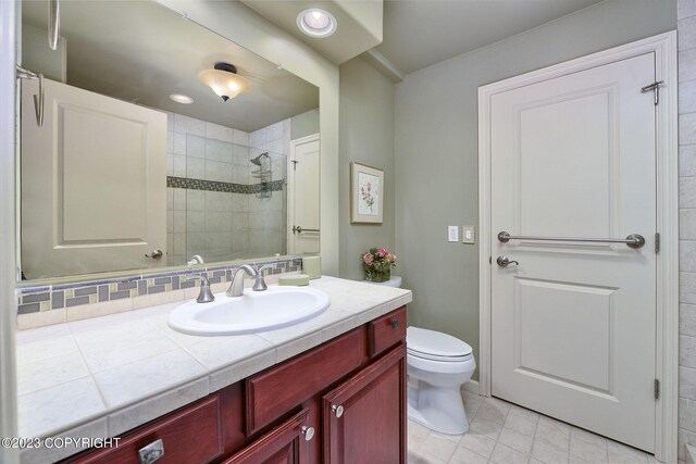 bathroom with tile patterned floors, toilet, and vanity