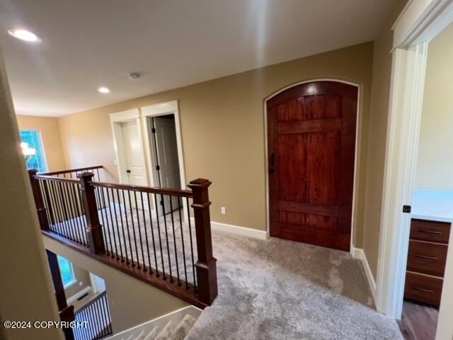 view of carpeted foyer