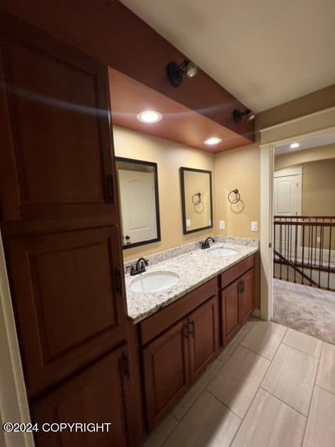 bathroom with tile patterned flooring and double sink vanity